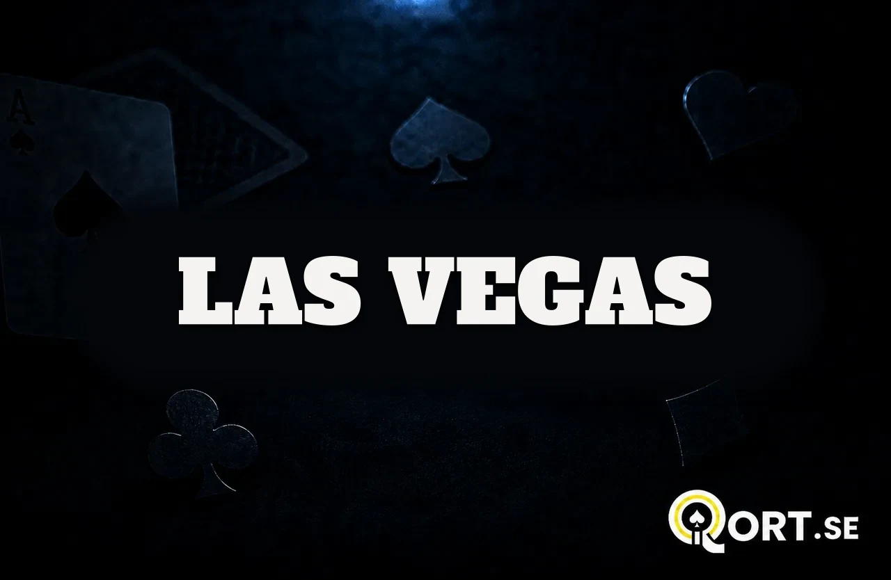 Mörkt kortbord med spelkort och färgsymboler och namnet Las Vegas